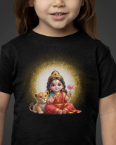 Child wearing a black t-shirt with a colorful graphic of a seated figure holding a flower and a lion cub.
